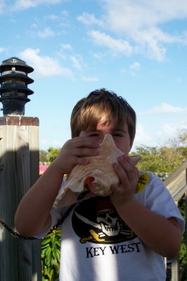 Blowing a Conch Shell in Key West (Scarborough photo)