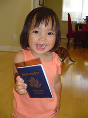 A kid and her passport (courtesy Flickr)