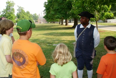 John, our costumed interpreter, leads the prospective apprentices at Colonial Williamsburg (Scarborough photo) 