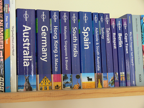 Lonely Planet guidebooks on a shelf (courtesy jasonnolanplymouth at flickr's Creative Commons.)
