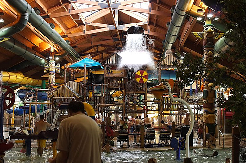 A typical Great Wolf Lodge indoor water park, with giant water bucket (courtesy thedriscolls5 on flickr CC)