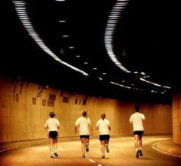runners in a tunnel