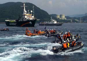 Greenpeace boats monitor a nuclear shipment