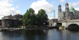 View of Athlone castle across the river shannon with trees