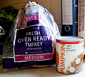 Fresh turkey and can of mashed pumpkin