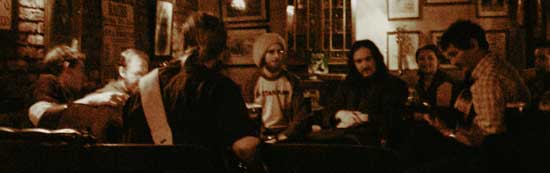 musicians gathered round the table at the weekly shack session in athlone