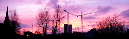 Athlone sunset with cranes for new town centre silloetted against the sky
