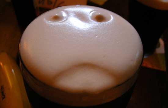 pint face in guinness irish stout