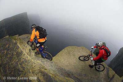 Hans Rey and Steve Peat cycling illegally inches from the death on the Cliffs of Moher - pic by Victor Lucas