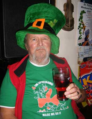 Sean of Sean's Bar, athlone with giant leprechaun hat, green t-shirt and pint of juice on Saint Patrick's Day 2007