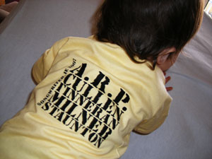 songwriter.ie artist names on the back of a baby's shirt