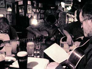 musicians gathered around the table at the shack session in athlone