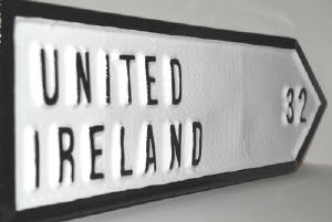 united ireland irish road sign with 32 county as the distance